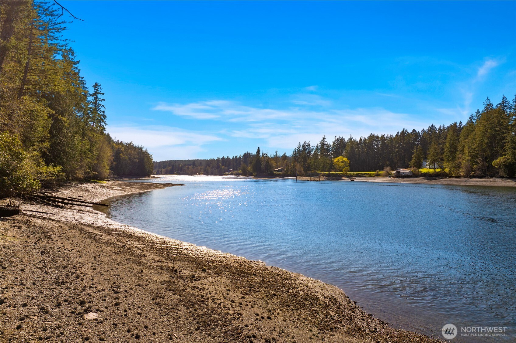 730 Southeast Nelson Road Shelton, WA 98584 - Photo 5 of 40 a view of a lake with houses in the background