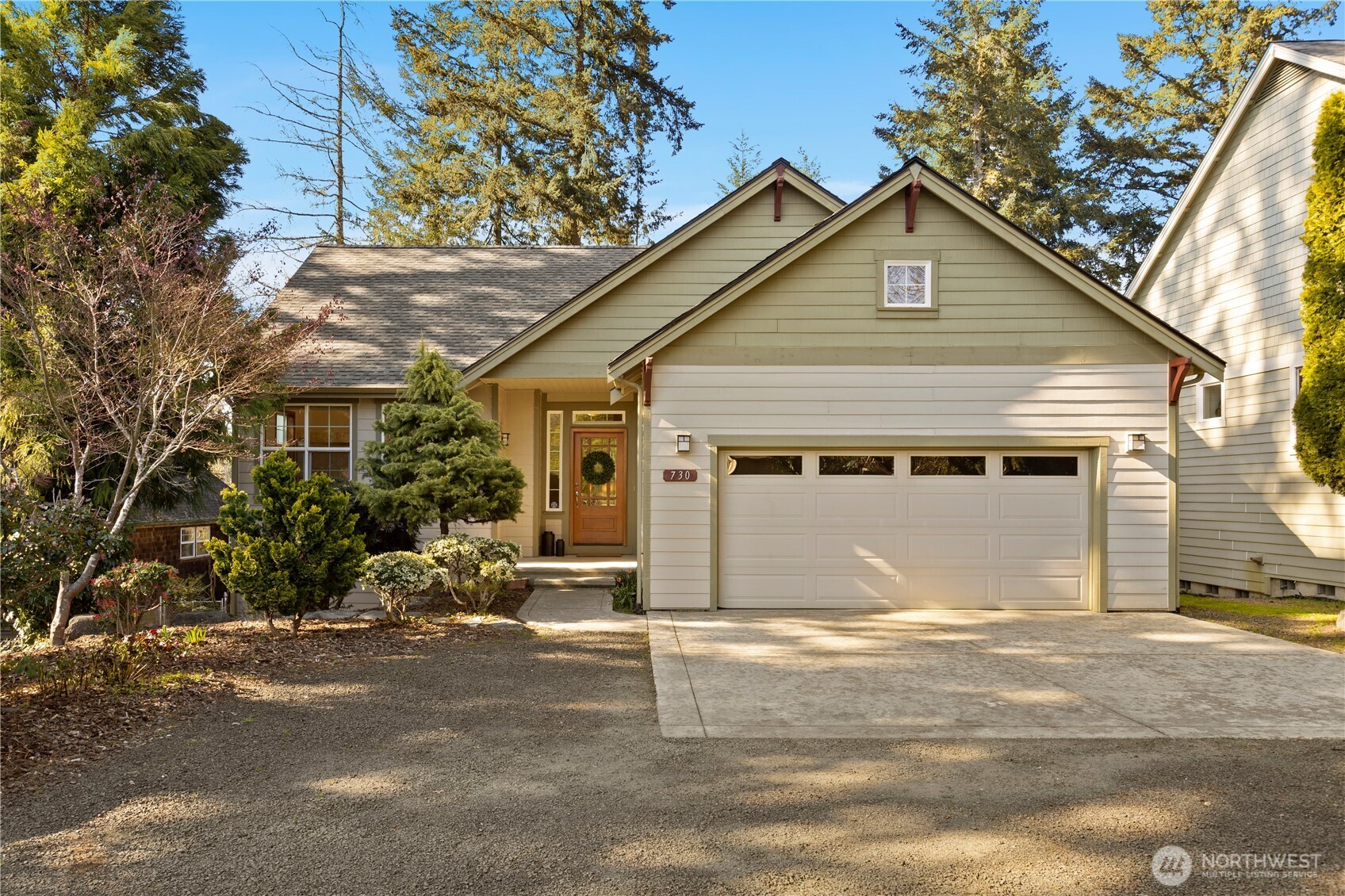 730 Southeast Nelson Road Shelton, WA 98584 - Photo 8 of 40 a front view of a house with a garage
