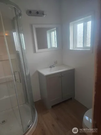 a bathroom with sink and mirror