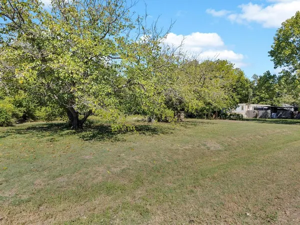 a view of a lake with a yard