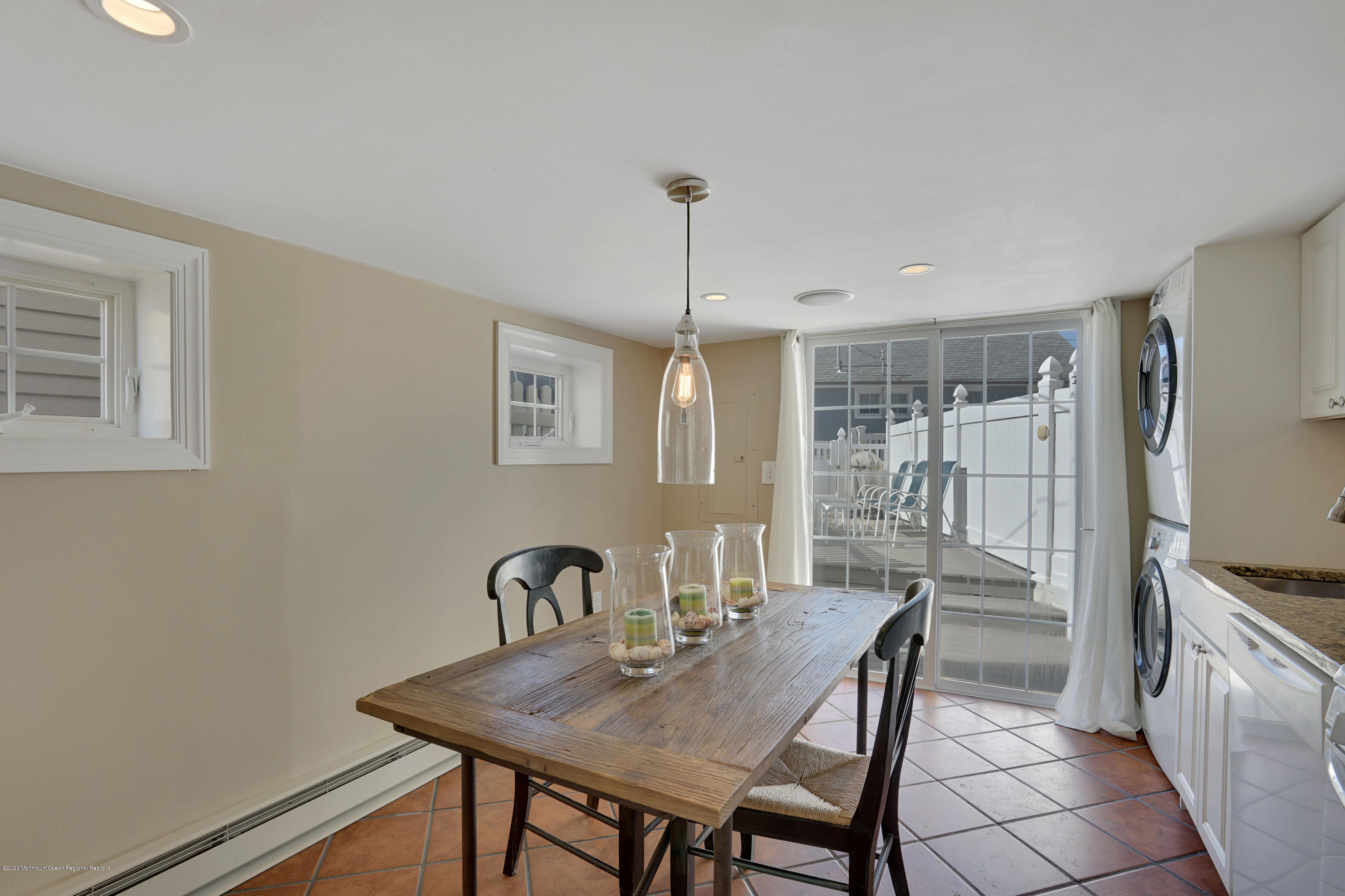 593 Brielle Road Manasquan, NJ 08736 - Photo 11 of 39 a view of a dining room with furniture window and wooden floor