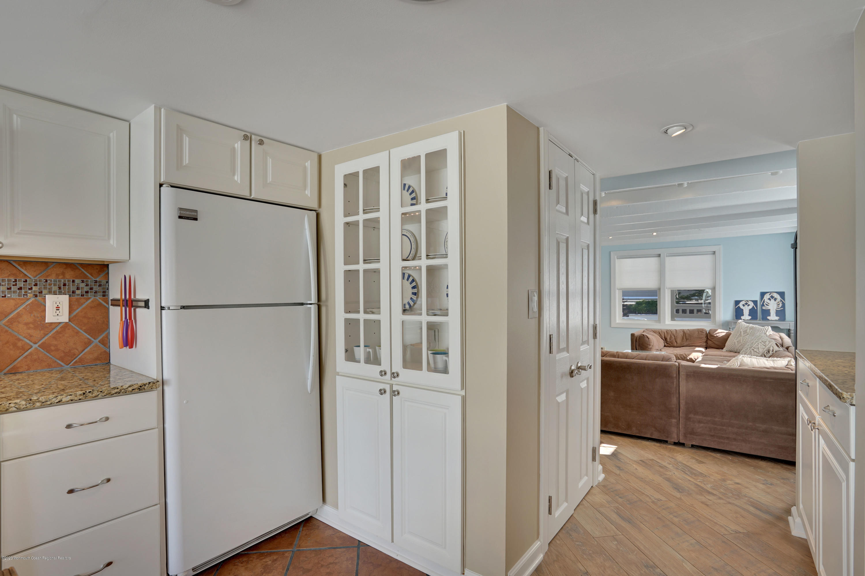 593 Brielle Road Manasquan, NJ 08736 - Photo 13 of 39 a kitchen with cabinets and refrigerator
