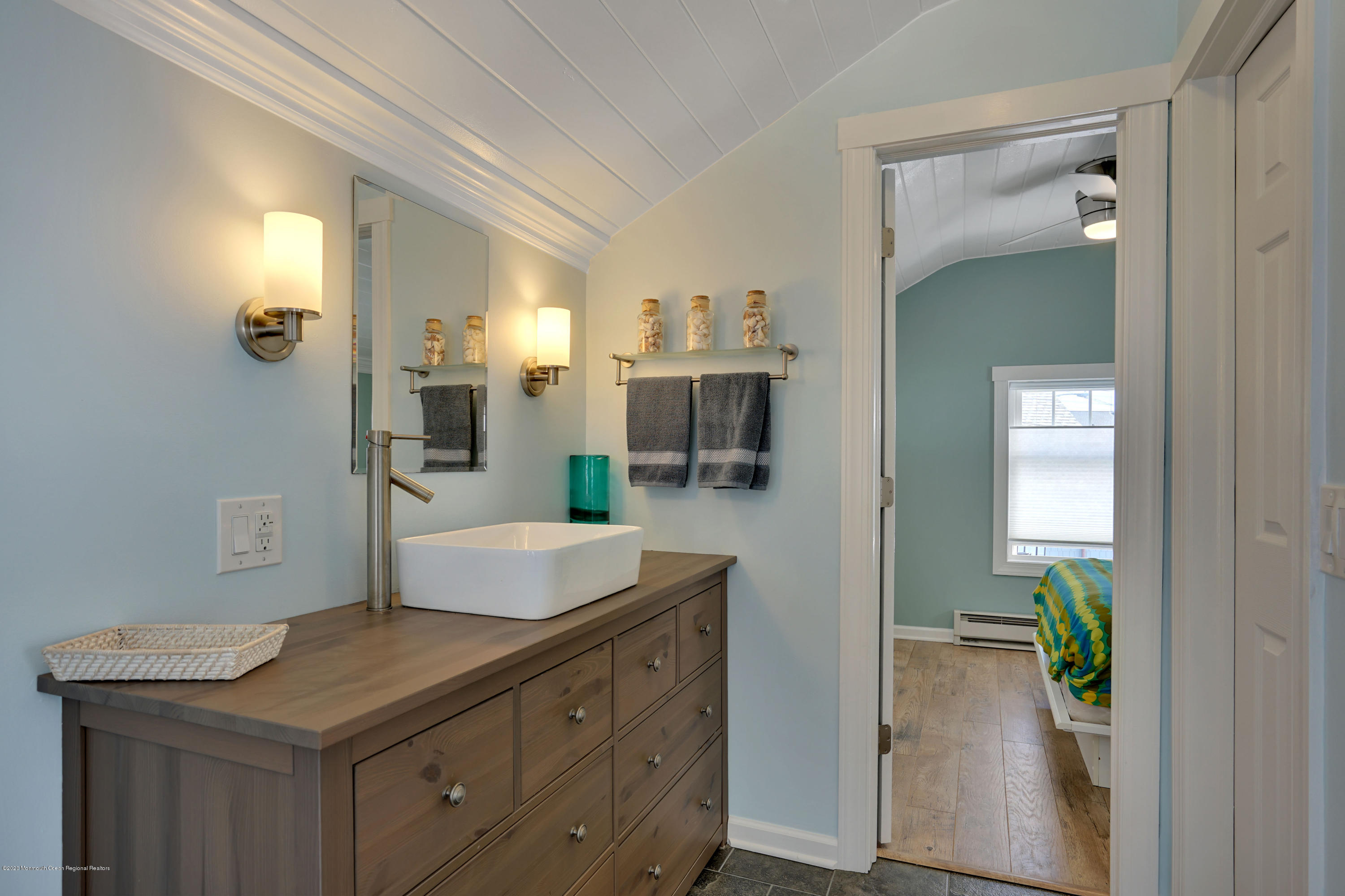 593 Brielle Road Manasquan, NJ 08736 - Photo 25 of 39 a spacious bathroom with a granite countertop sink and a mirror
