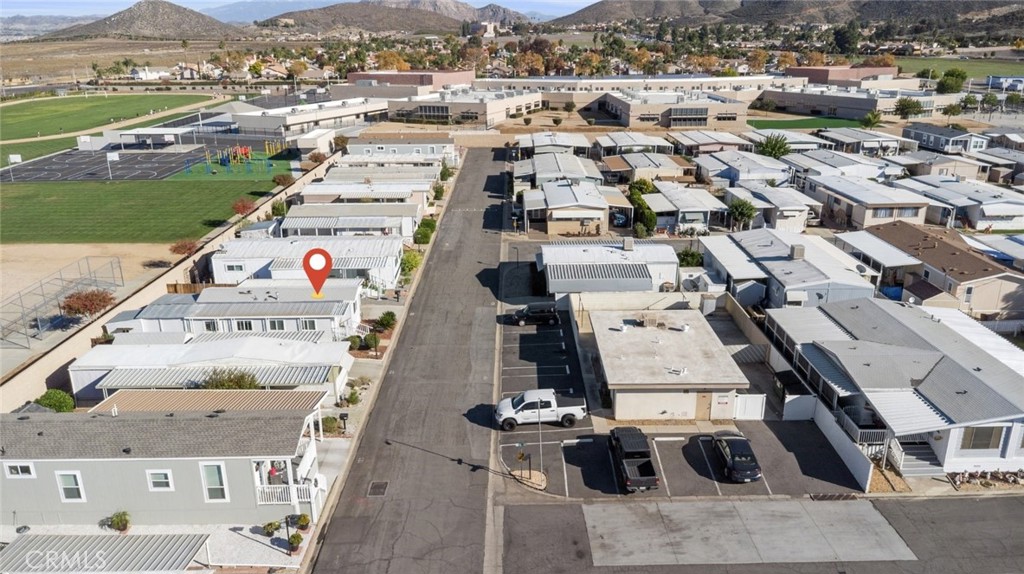 27150 Shadel Road, Unit 122 Menifee, CA 92586 - Photo 26 of 26 an aerial view of residential houses with outdoor space