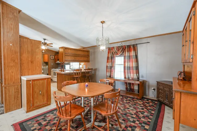 a dining room with furniture and window
