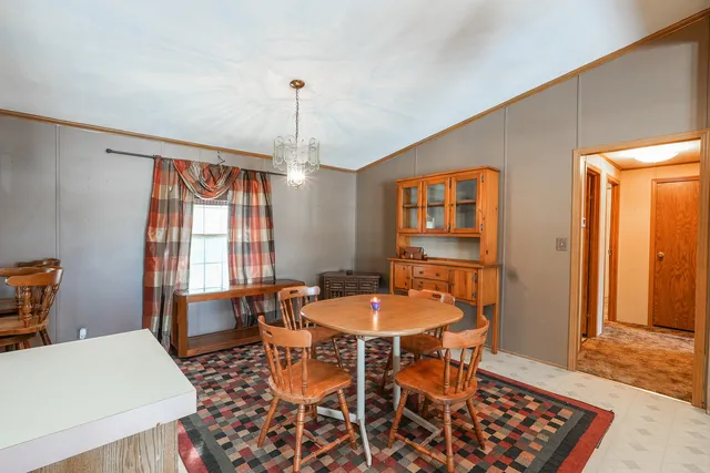 a kitchen with stainless steel appliances granite countertop a sink a stove and cabinets