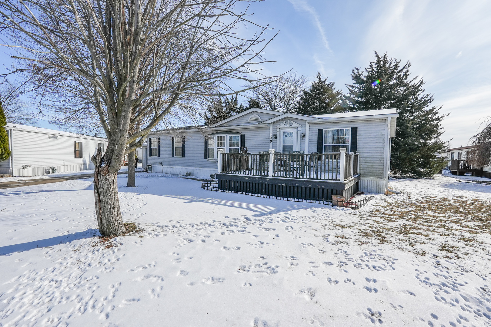 149 Daniel Court Manteno, IL 60950 - Photo 2 of 30 a front view of a house with a yard covered in snow