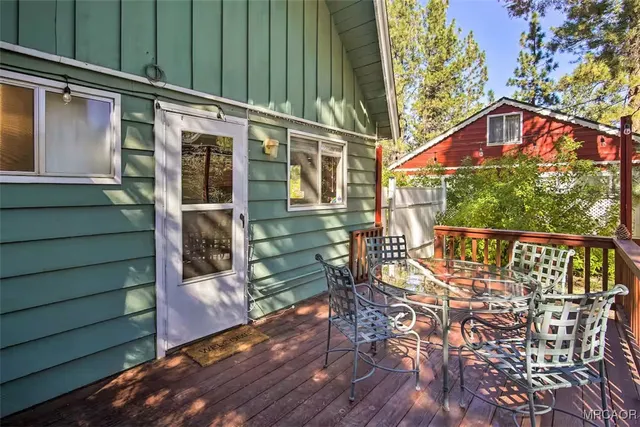 a view of a chair and table in the balcony