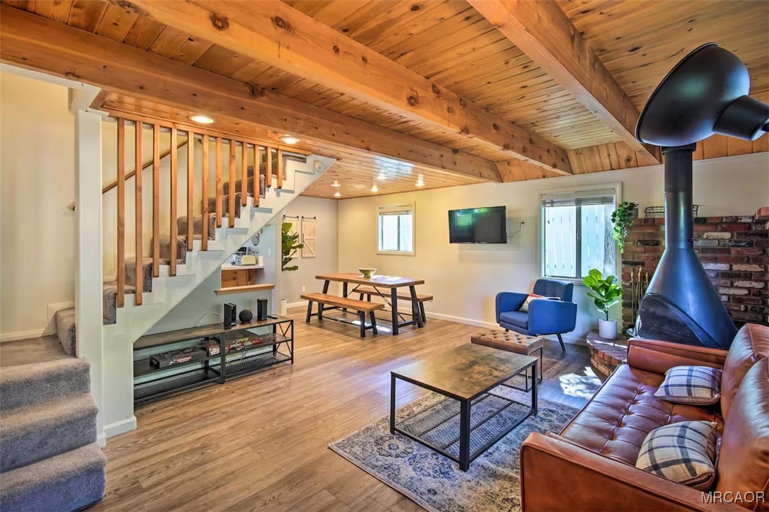 161 Moreno Lane Sugarloaf, CA 92386 - Photo 12 of 14 a living room with furniture stairs and a large window