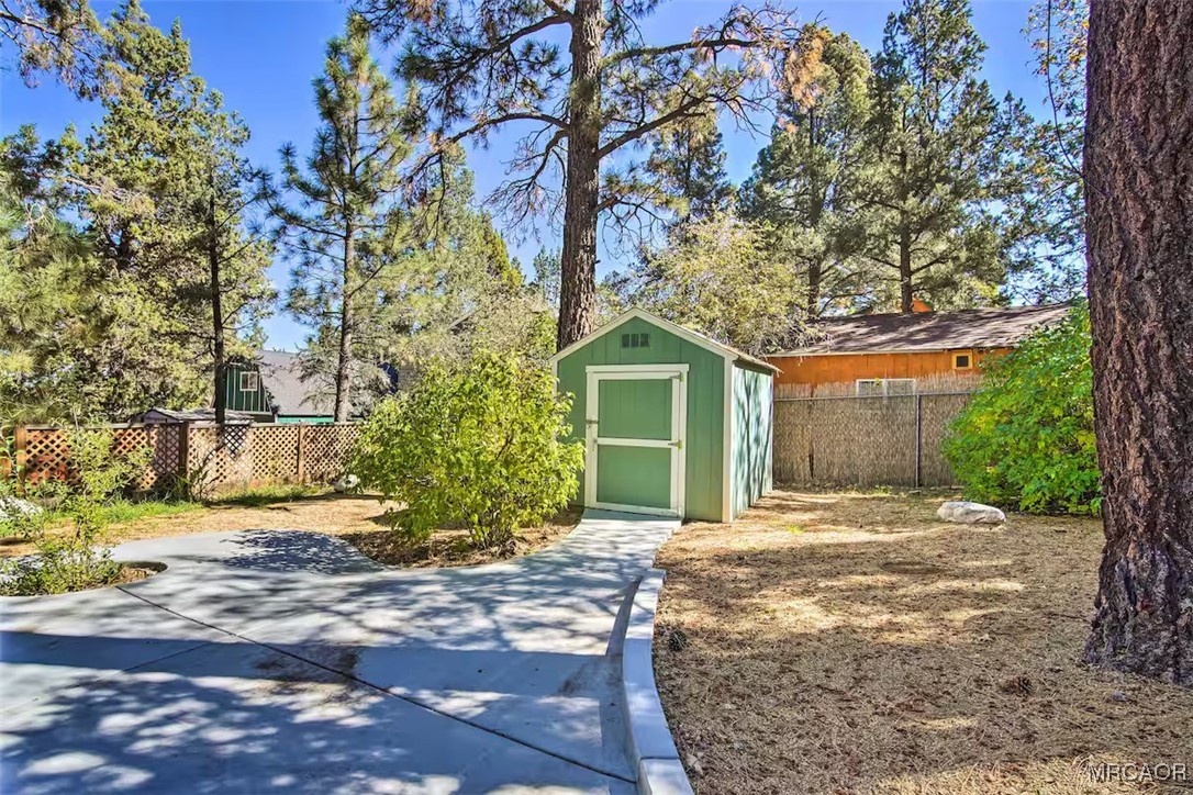 161 Moreno Lane Sugarloaf, CA 92386 - Photo 8 of 14 a front view of a house with a yard and tree s