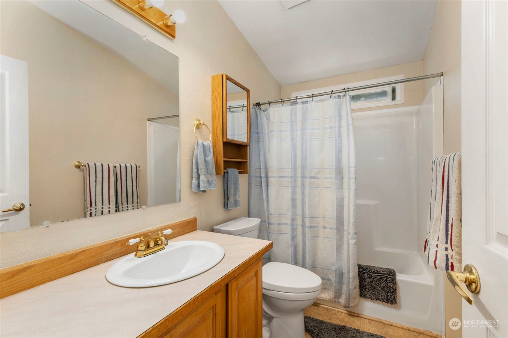 2123 East Quilcene Road Quilcene, WA 98376 - Photo 18 of 37 a bathroom with a sink toilet and shower