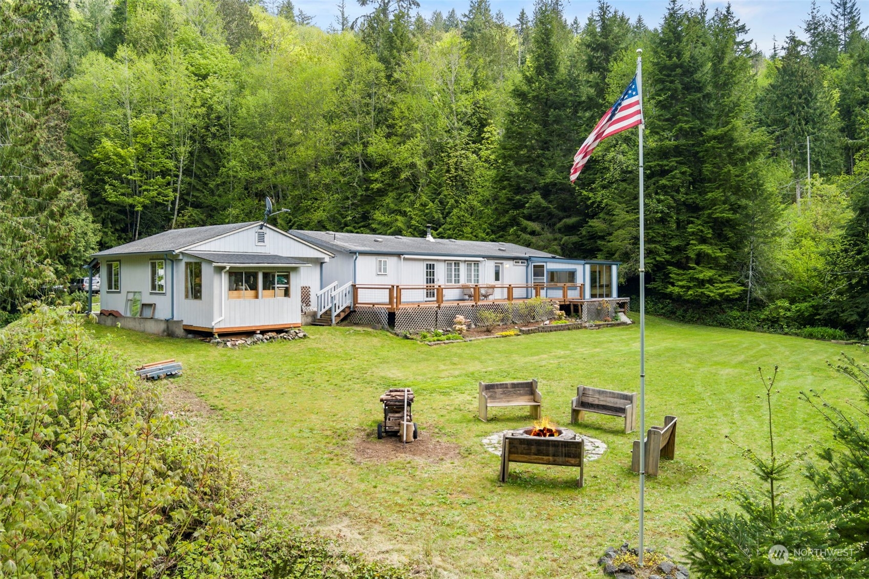 2123 East Quilcene Road Quilcene, WA 98376 - Photo 25 of 37 a front view of house with swimming pool and garden