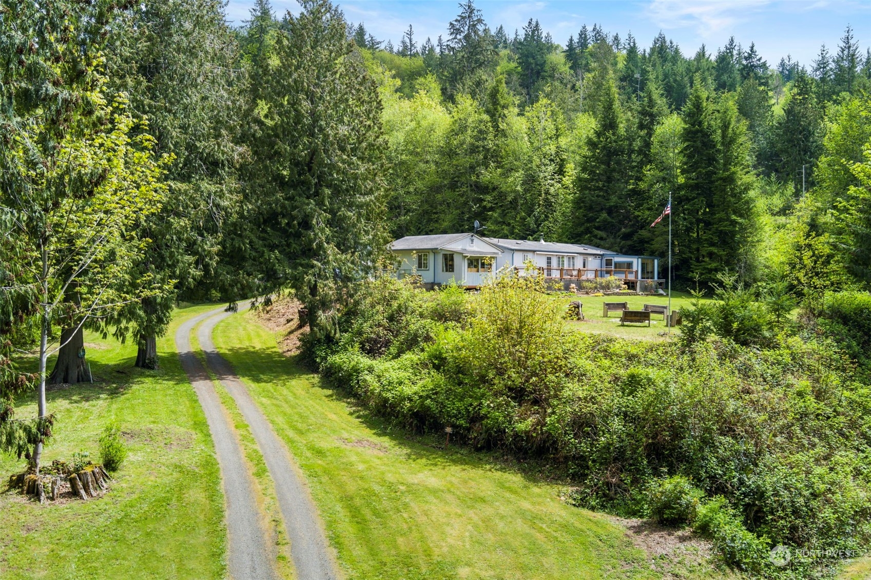 2123 East Quilcene Road Quilcene, WA 98376 - Photo 3 of 37 a view of a swimming pool with a garden