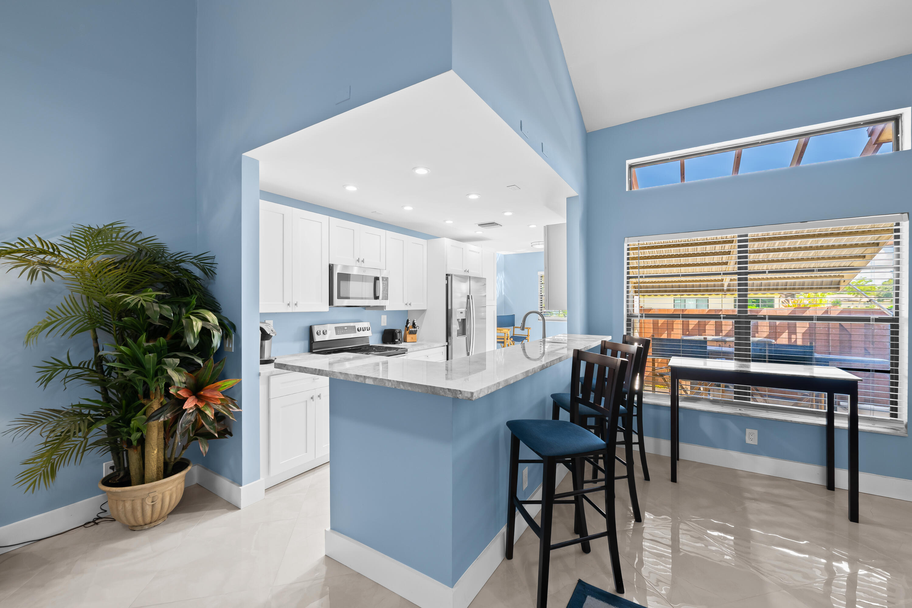 14079 Nesting Way, Unit B Delray Beach, FL 33484 - Photo 8 of 26 a kitchen with a table and chairs in it