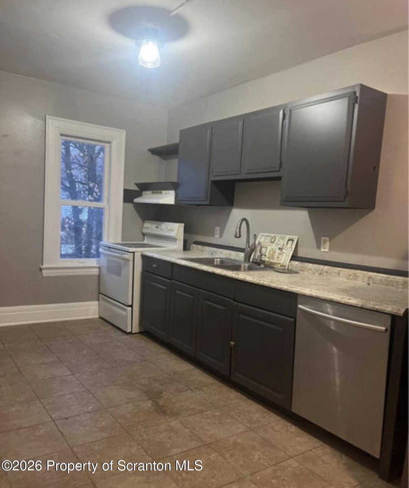 85 Main Street Olyphant, PA 18447 - Photo 13 of 29 a kitchen with a sink cabinets and window
