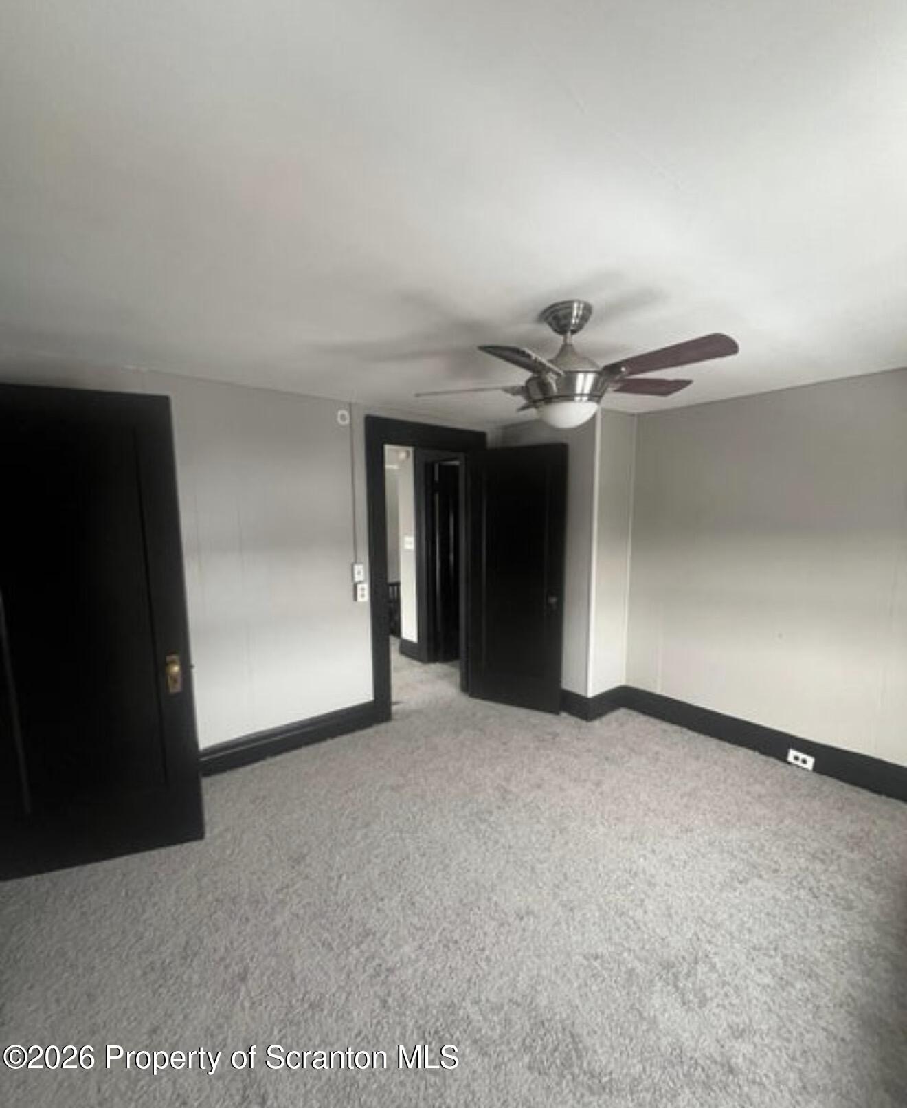 85 Main Street Olyphant, PA 18447 - Photo 21 of 29 a view of a livingroom with a ceiling fan and window