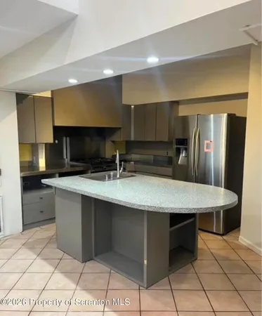 a kitchen with a stove and a microwave