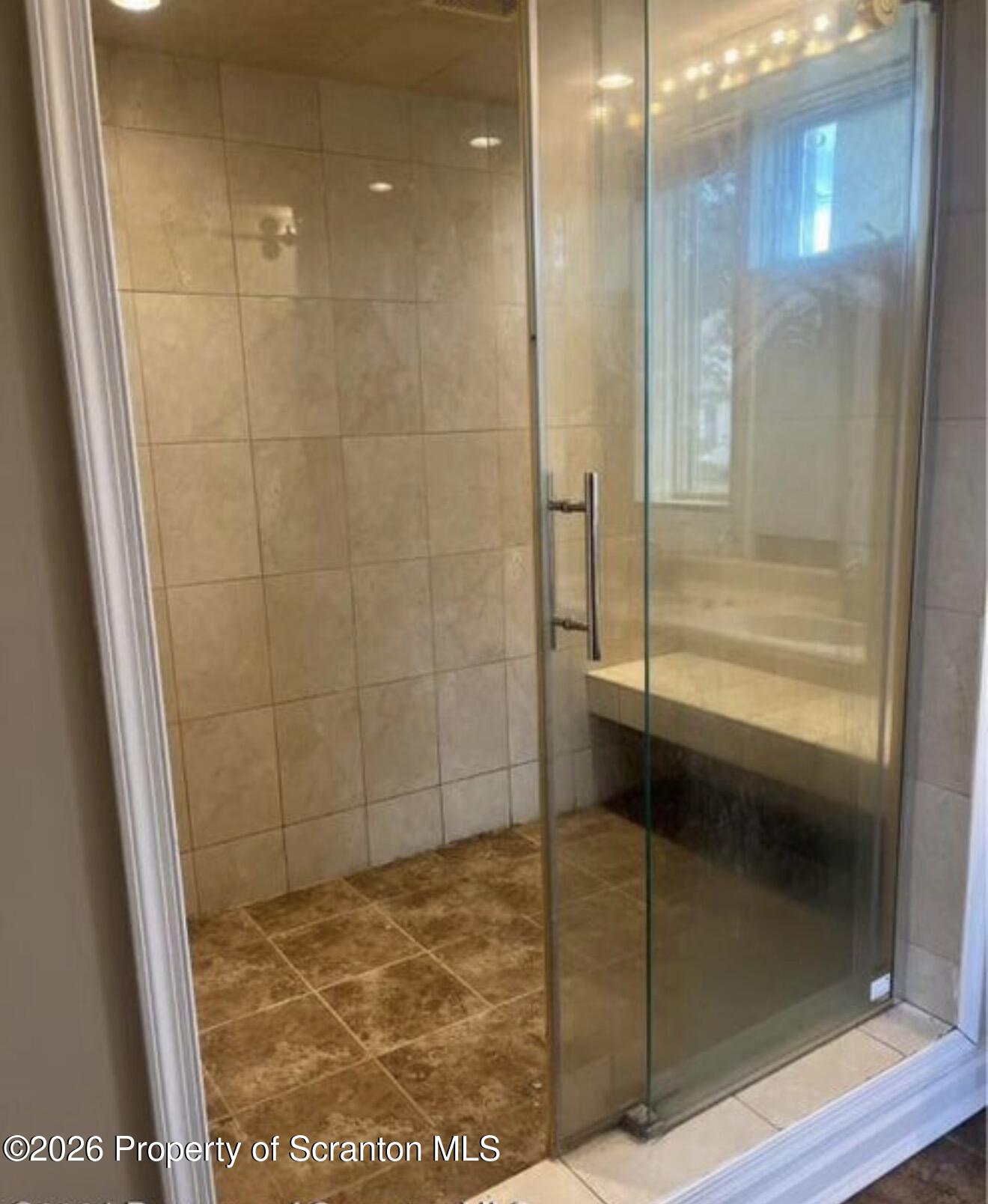 85 Main Street Olyphant, PA 18447 - Photo 29 of 29 a bathroom with a glass shower door