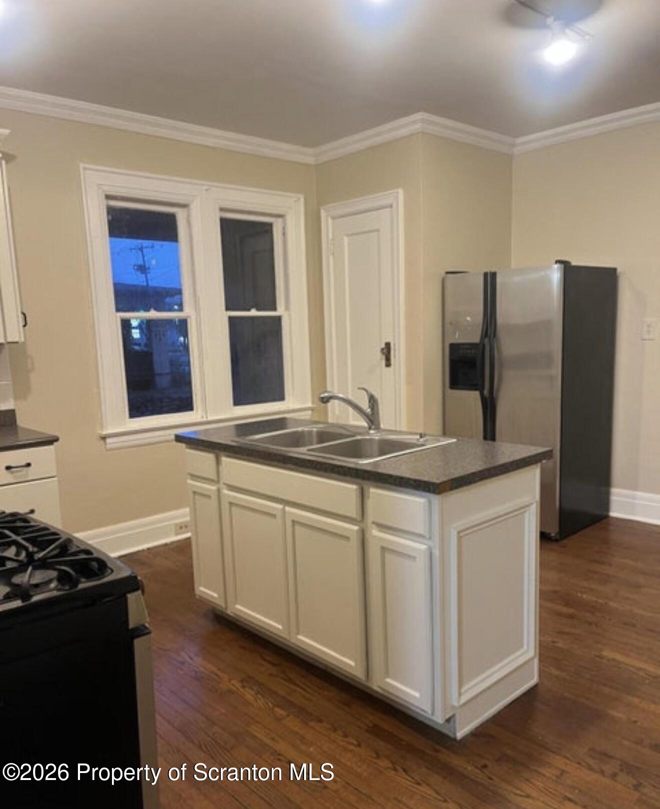 85 Main Street Olyphant, PA 18447 - Photo 3 of 29 a kitchen with stainless steel appliances granite countertop a stove and a refrigerator