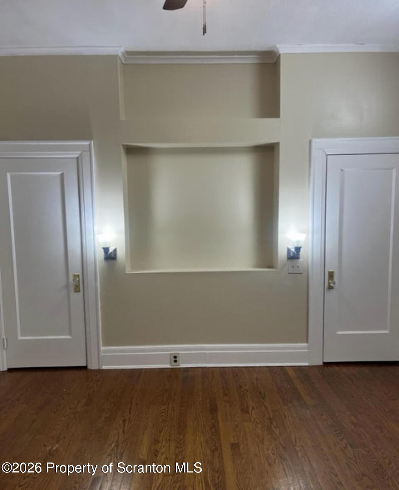 85 Main Street Olyphant, PA 18447 - Photo 6 of 29 an empty room with wooden floor and closet