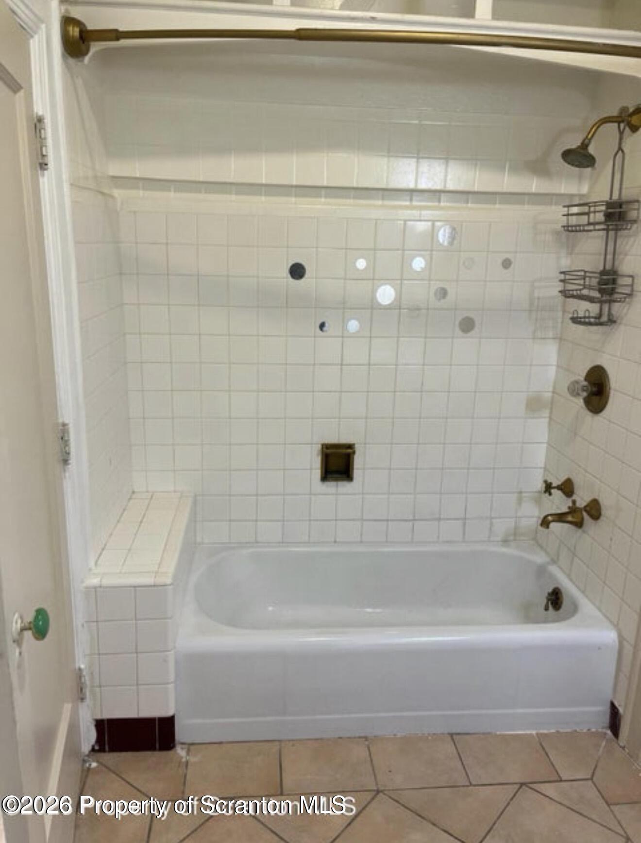85 Main Street Olyphant, PA 18447 - Photo 8 of 29 a bathroom with a bathtub and a shower
