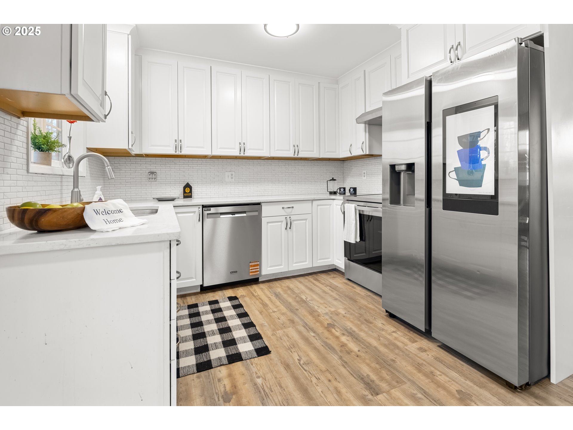 4207 Southwest Sheridan Avenue Pendleton, OR 97801 - Photo 11 of 34 a kitchen with a sink a stove and cabinets