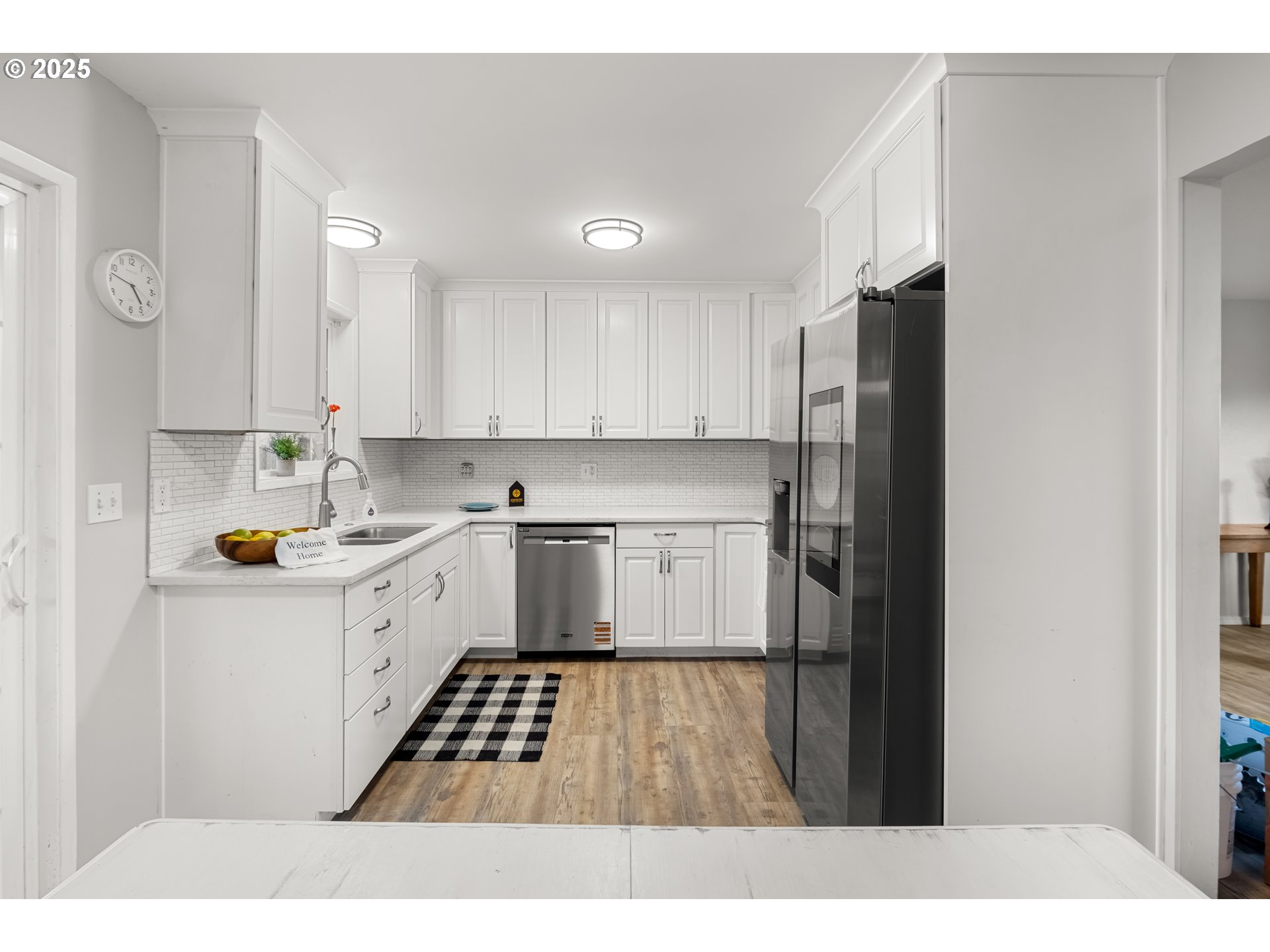 4207 Southwest Sheridan Avenue Pendleton, OR 97801 - Photo 12 of 34 a kitchen with white cabinets and white appliances