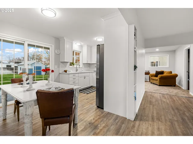 a spacious bathroom with a double vanity sink a toilet and a tub