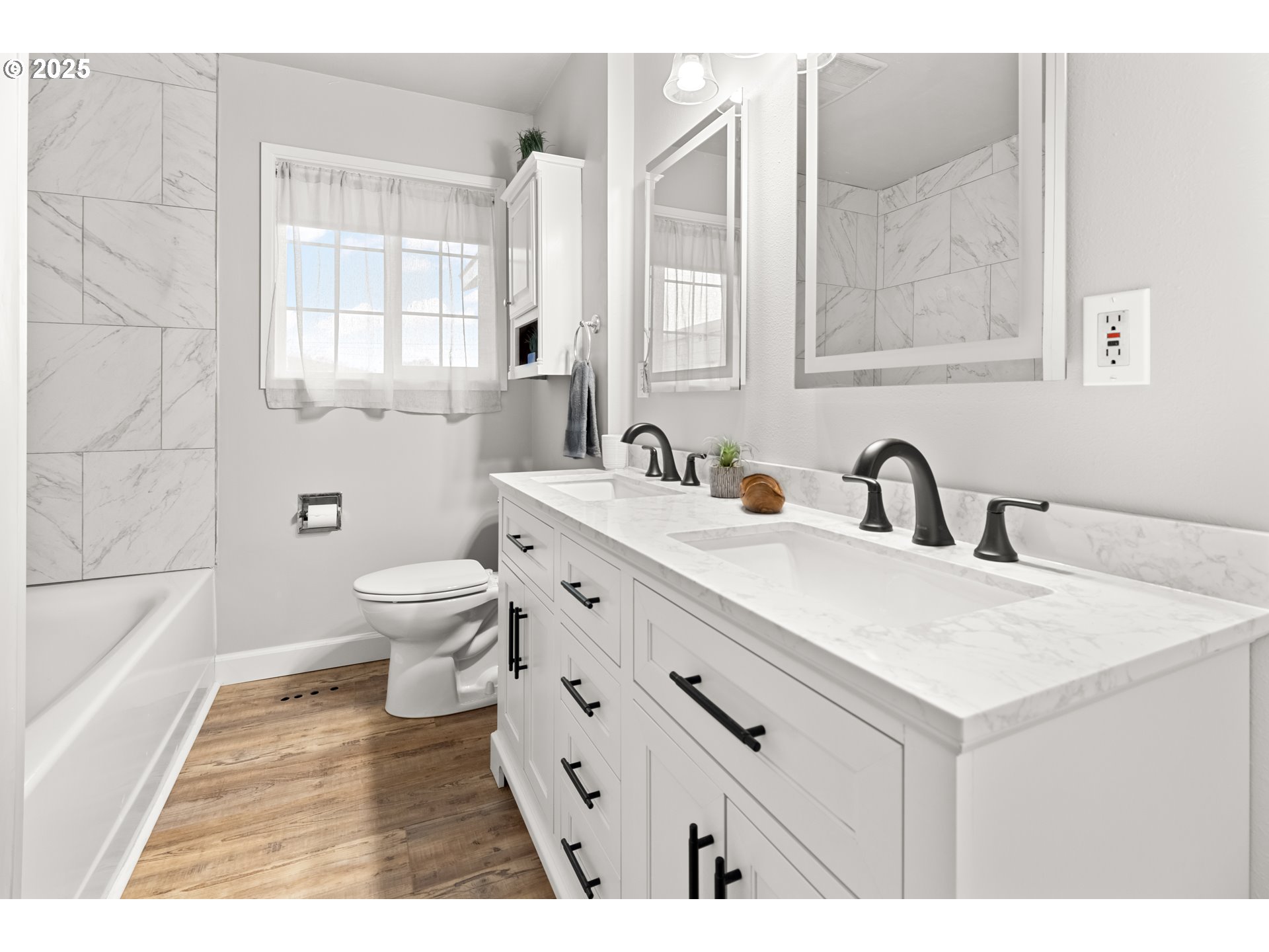 4207 Southwest Sheridan Avenue Pendleton, OR 97801 - Photo 16 of 34 a spacious bathroom with a double vanity sink a toilet and a tub
