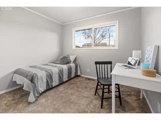 a view of wooden floor and workspace in a room