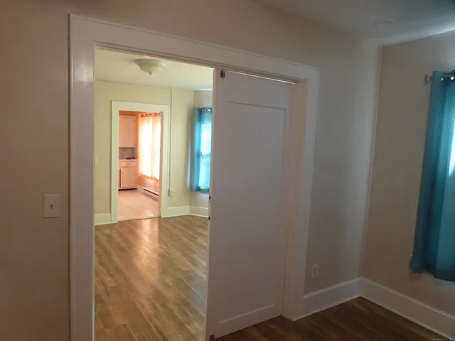 a kitchen with a refrigerator sink and cabinets