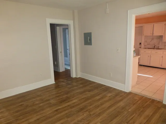 a kitchen with a stove top oven and cabinets