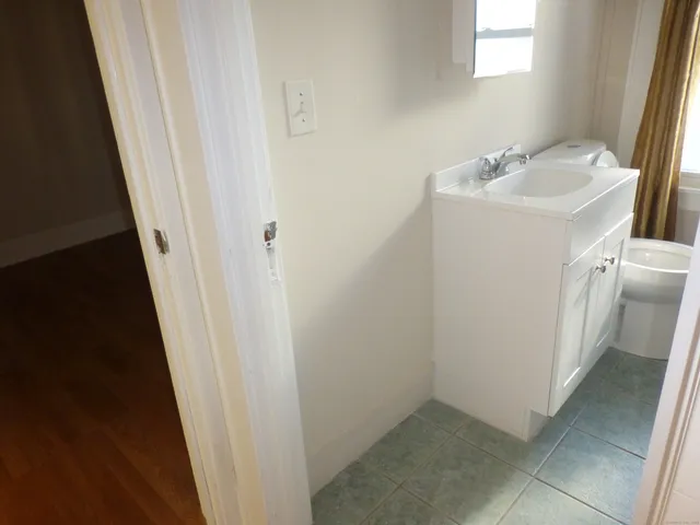 an empty room with wooden floor