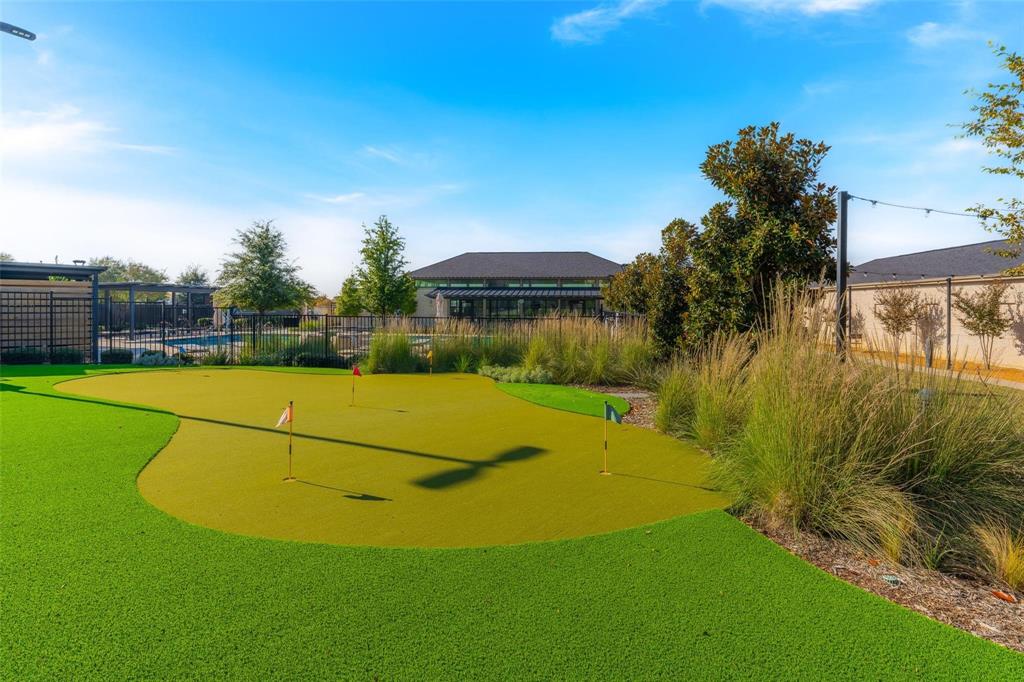 651 Watters Road, Unit 8204 Allen, TX 75013 - Photo 19 of 19 Putting green with multiple holes, artificial turf, and surrounding landscaping