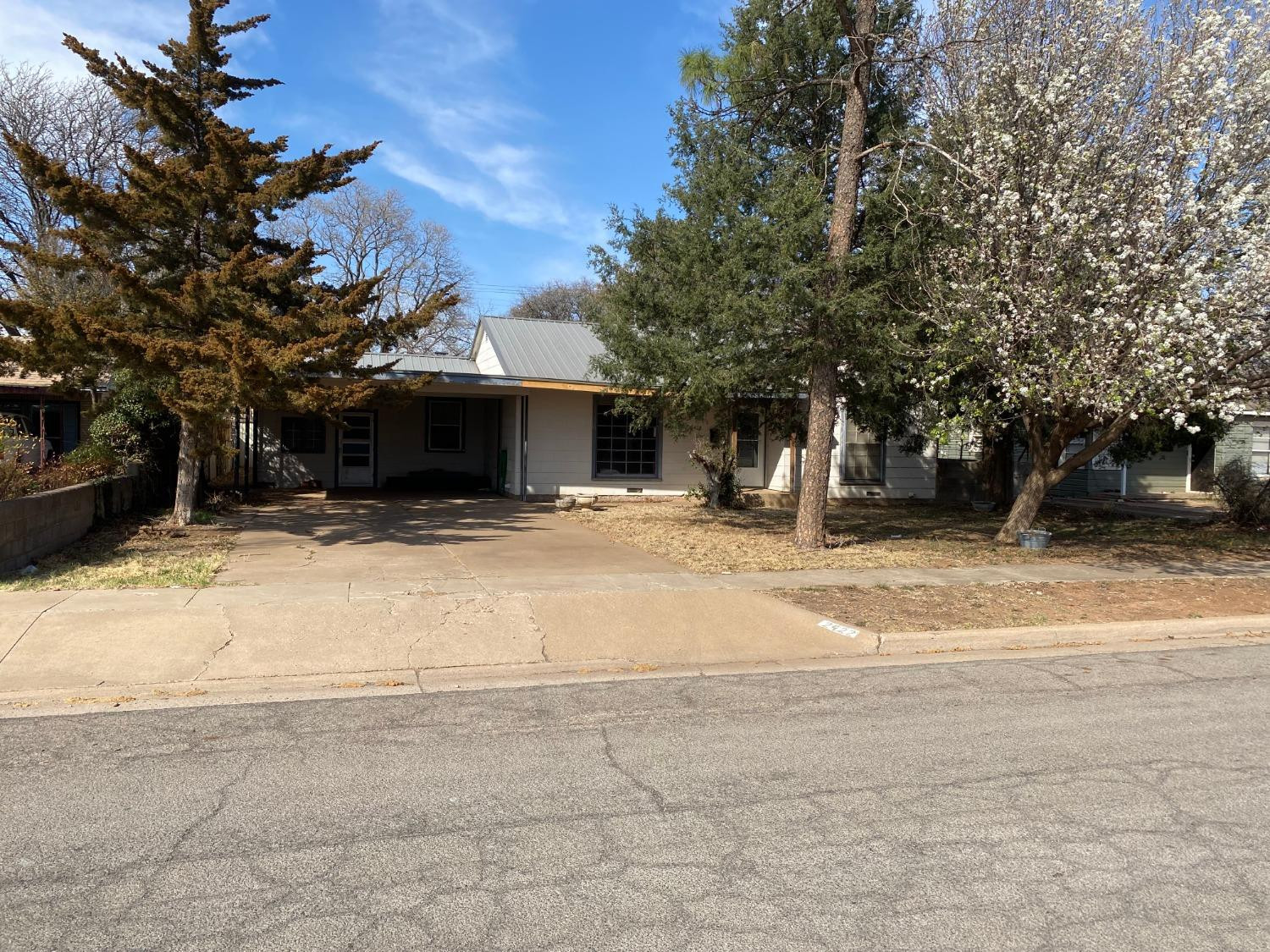 2422 33rd Street Lubbock, TX 79411 - Photo 1 of 35 a view of a house with snow on the road