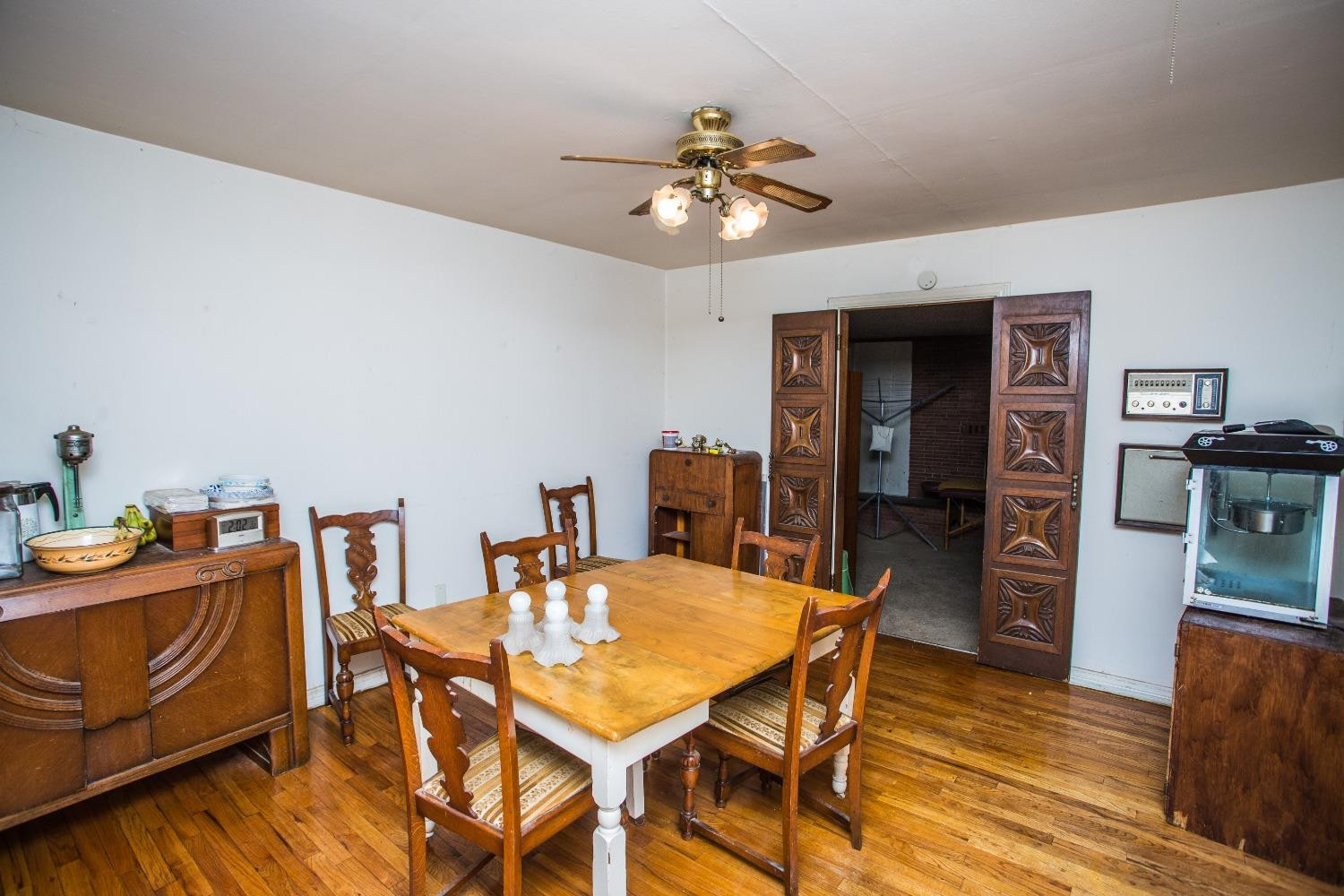 2422 33rd Street Lubbock, TX 79411 - Photo 12 of 35 a dining room with furniture and chandelier