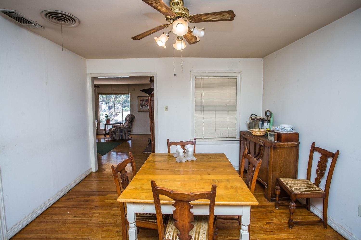 2422 33rd Street Lubbock, TX 79411 - Photo 14 of 35 a dining room with a table and chairs