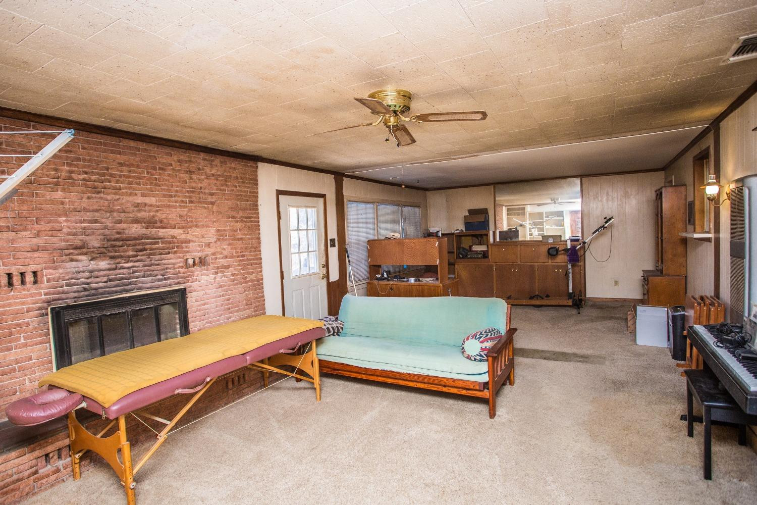 2422 33rd Street Lubbock, TX 79411 - Photo 15 of 35 a living room with furniture pool table and flat screen tv