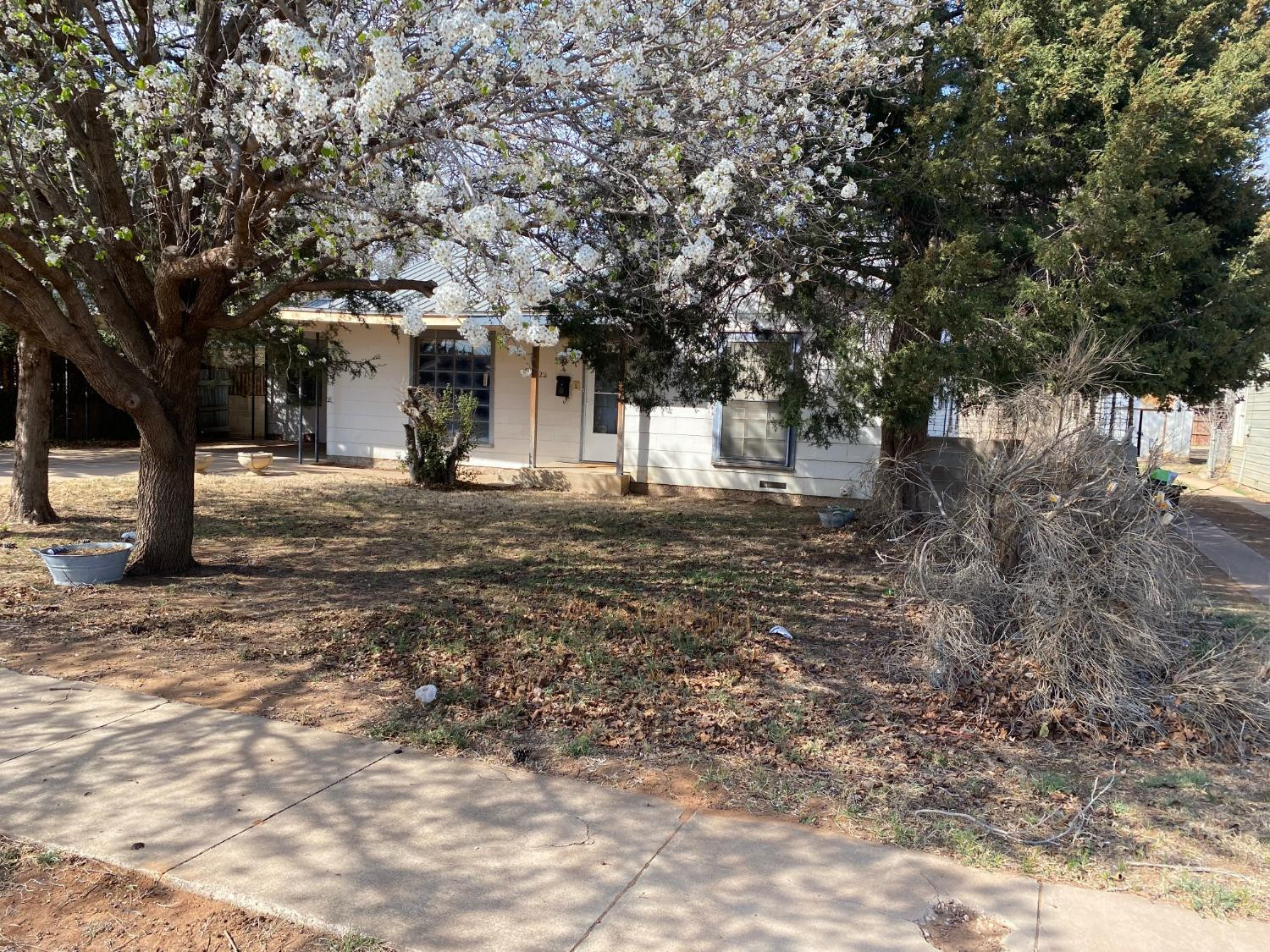 2422 33rd Street Lubbock, TX 79411 - Photo 3 of 35 a front view of a house with a yard