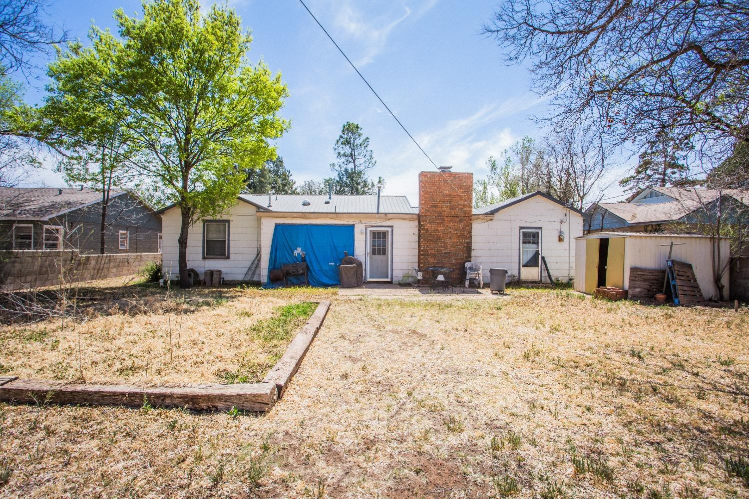 2422 33rd Street Lubbock, TX 79411 - Photo 33 of 35 a view of a house with a yard covered in snow
