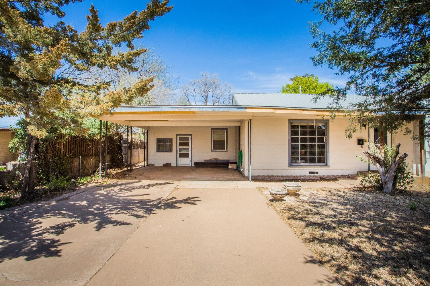 2422 33rd Street Lubbock, TX 79411 - Photo 35 of 35 a front view of a house with a garden