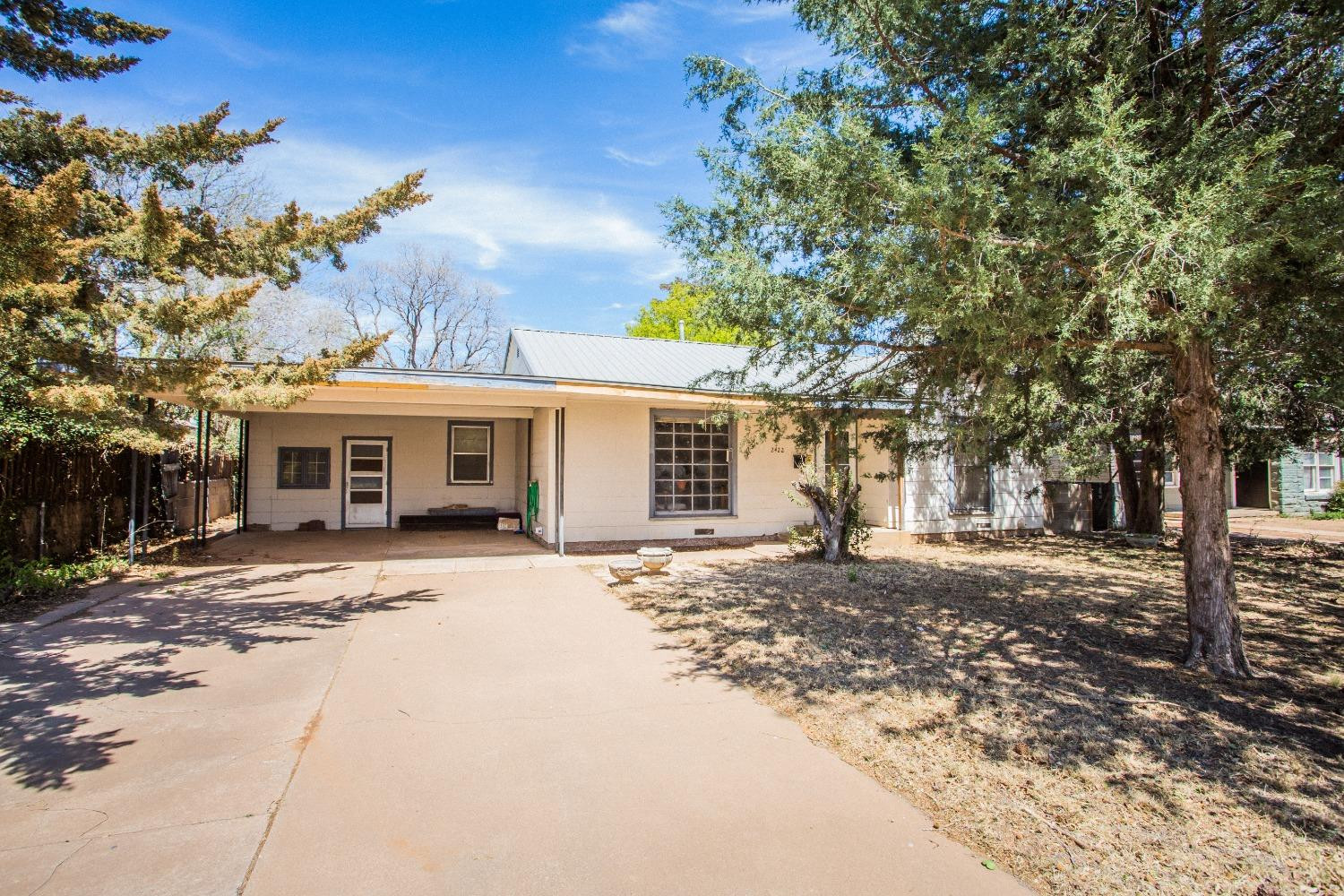 2422 33rd Street Lubbock, TX 79411 - Photo 8 of 35 a view of a yard in front of a house
