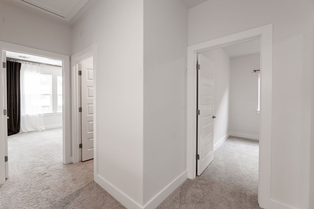 6414 Cowman Way Austin, TX 78747 - Photo 32 of 35 Crisp white trim and soft carpeting define this welcoming upper level landing space.