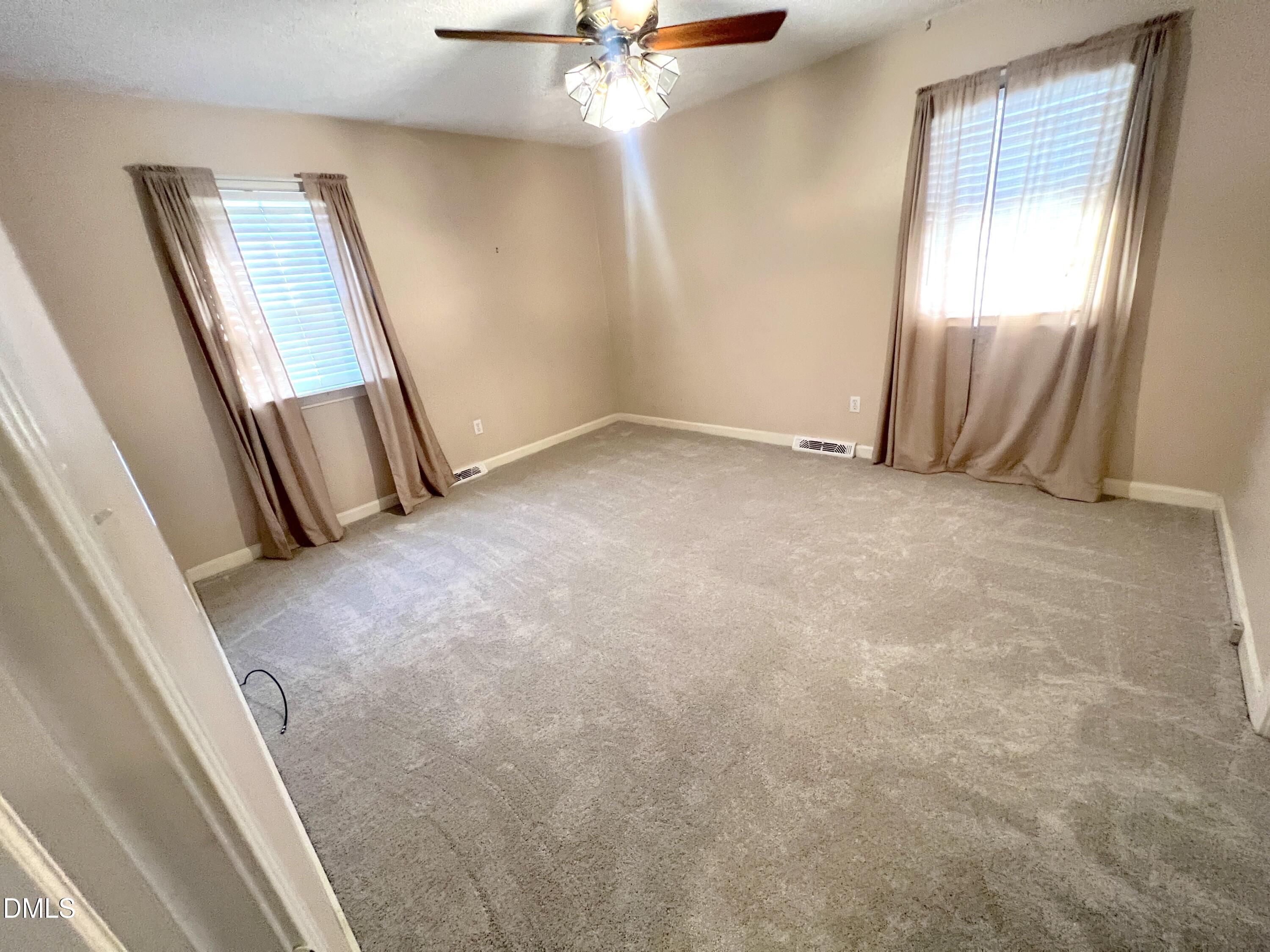 66 Allensville Road Roxboro, NC 27573 - Photo 18 of 52 an empty room with a mirror