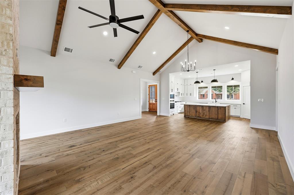509 Emma Lane Grandview, TX 76050 - Photo 11 of 35 a view of a livingroom with wooden floor and furniture