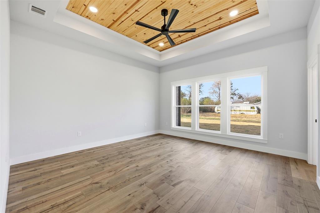 509 Emma Lane Grandview, TX 76050 - Photo 20 of 36 a view of a room with wooden floor and window