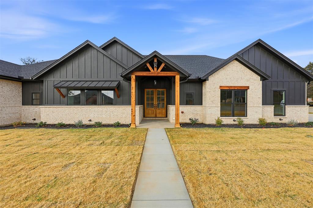 509 Emma Lane Grandview, TX 76050 - Photo 2 of 36 a front view of a house with yard