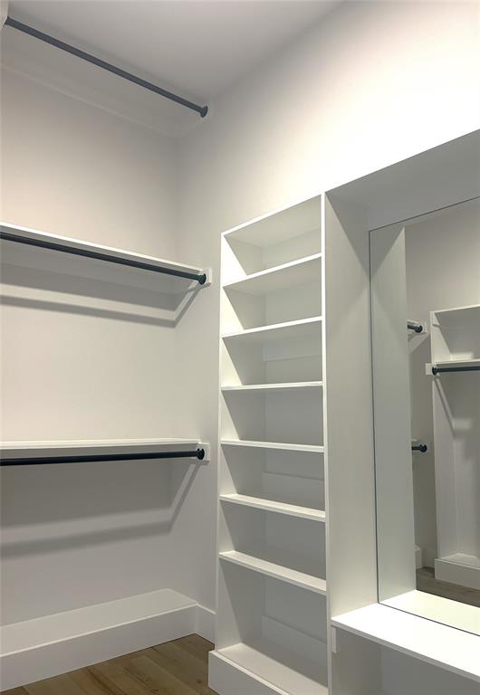 509 Emma Lane Grandview, TX 76050 - Photo 25 of 35 a view of walk in closet with empty racks