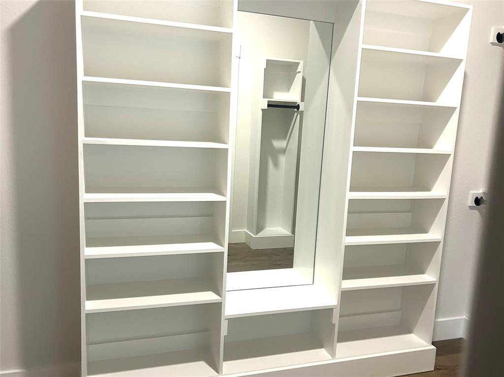 509 Emma Lane Grandview, TX 76050 - Photo 26 of 35 a view of walk in closet with empty racks