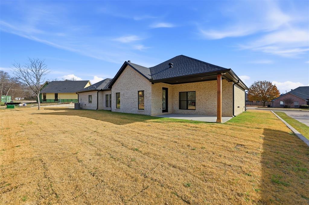 509 Emma Lane Grandview, TX 76050 - Photo 3 of 35 a view of a house with a yard